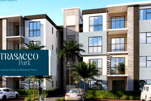 Front view of the apartments at Trasacco Park, with contemporary facades, spacious balconies, and lush gardens